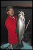 Josh Choronzey hoists a large Chinook taken in Owen Sound Bay.  The fish was caught on a Spin Doctor and Anchovy combo in 90 feet of water.