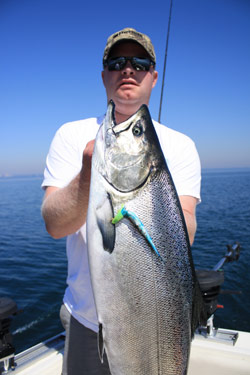 Jeremiah Johnson, of Owen Sound wasn't interested in local Lake Trout fishing, as he traveled to Lake Ontario to battle big king salmon this past week.
